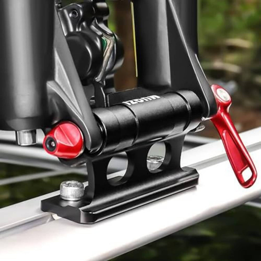 Bike fork support on car roof rack with red lever and black mounting bracket