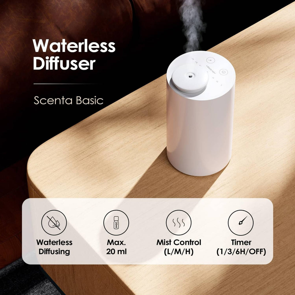Waterless essential oil diffuser, white cylinder on tabletop with visible mist plume