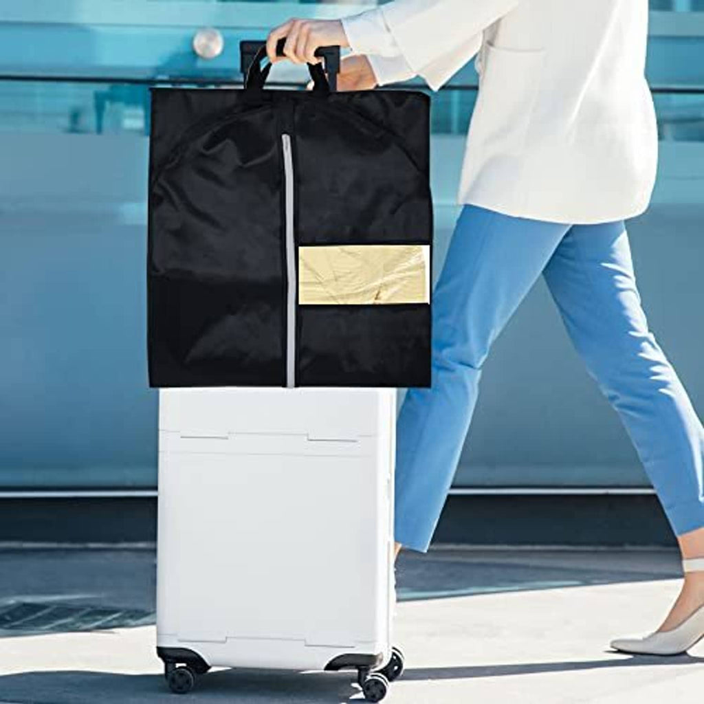 Black garment bag carried by top handle with zip front and clear window pocket