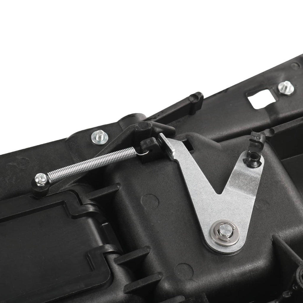 Interior door handle assembly with black housing, spring hardware, and mounting screws