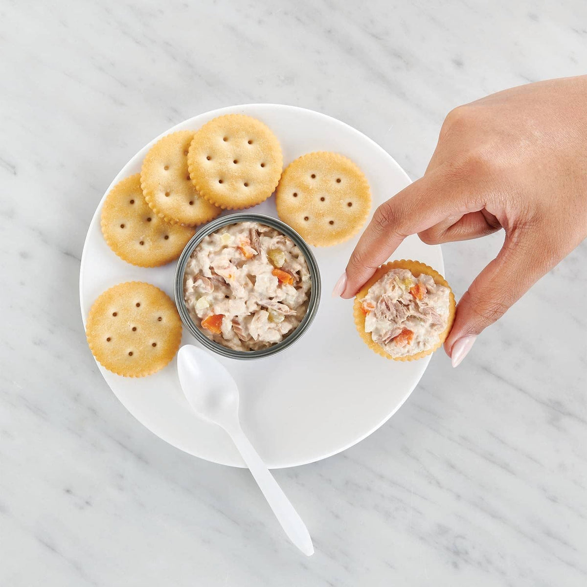Tuna salad kit cup with crackers and spoon, ready-to-eat portion