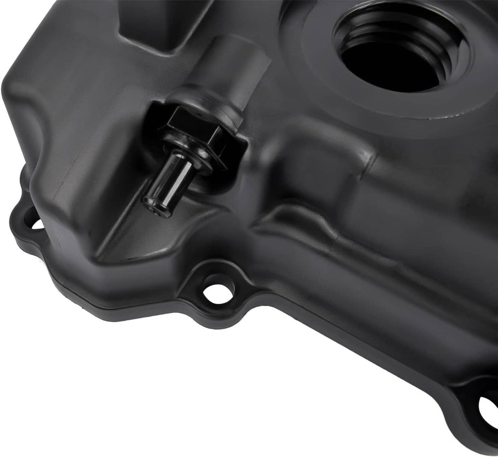 Black valve cover close-up showing small tab bracket and mounting hole