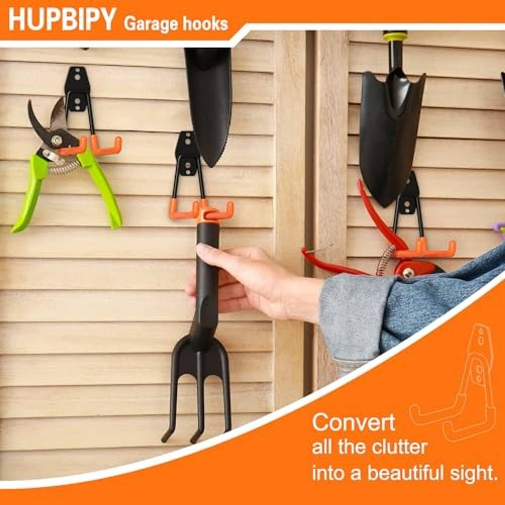 Orange and black U-hook garage wall hook being installed on a wooden wall.