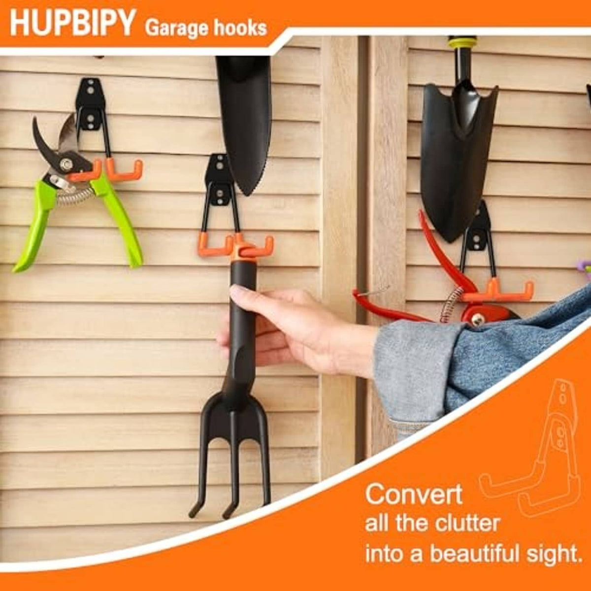 Orange and black U-hook garage wall hook being installed on a wooden wall.