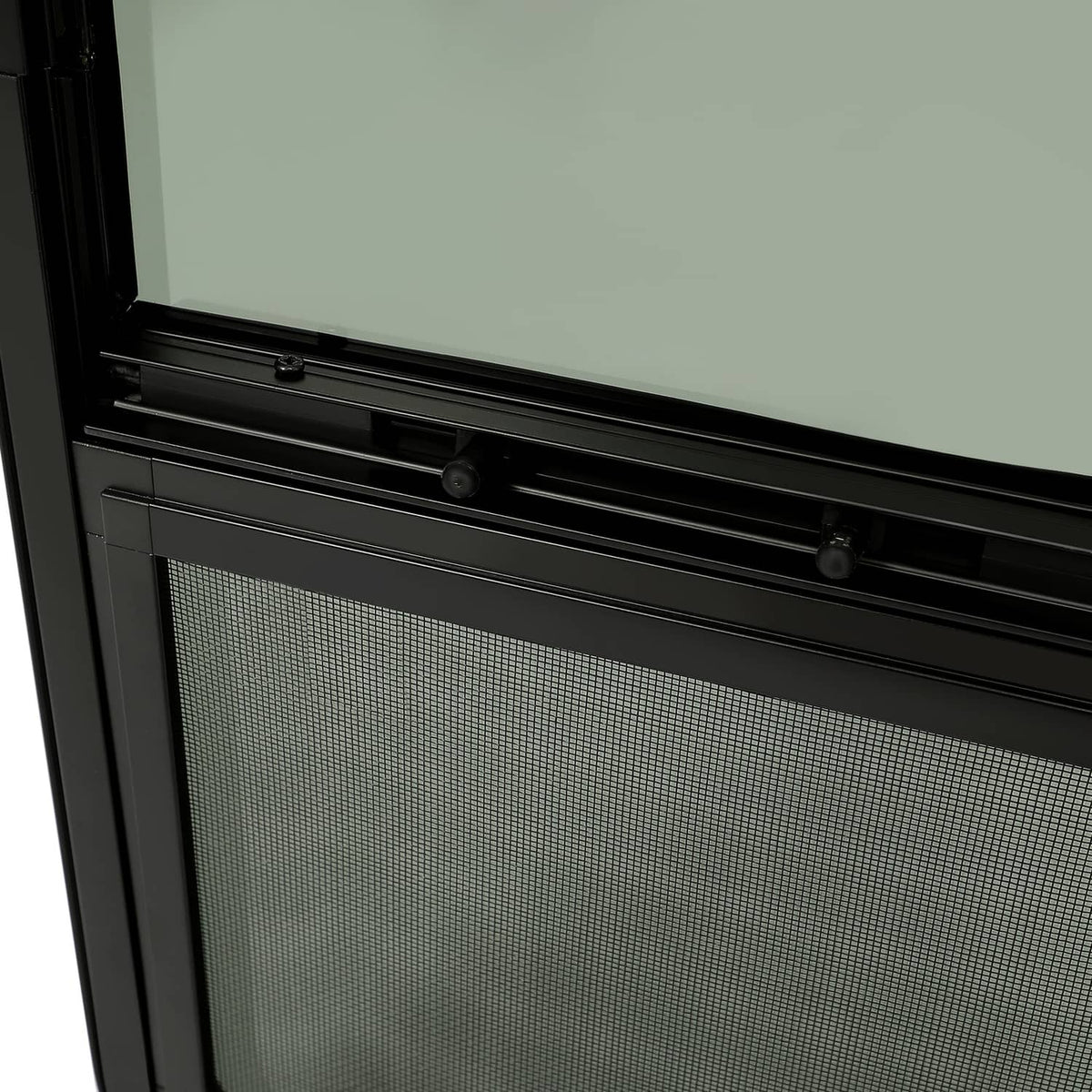 Tinted RV window installed in black trim, with upper tinted glass and lower screen