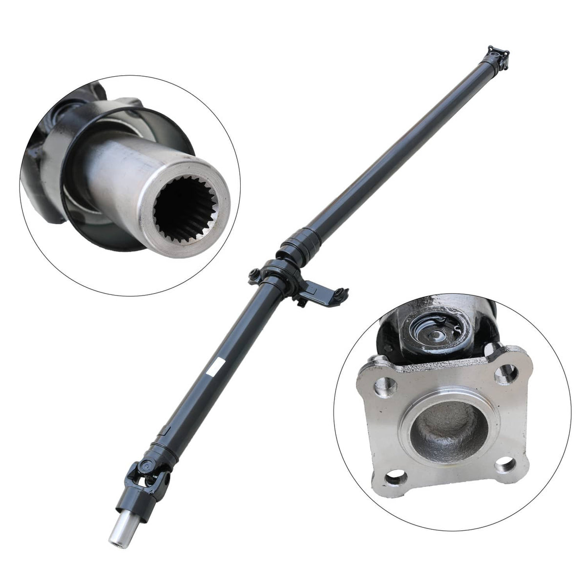 Rear drive shaft with yoke and splined coupling ends, black and silver metal parts