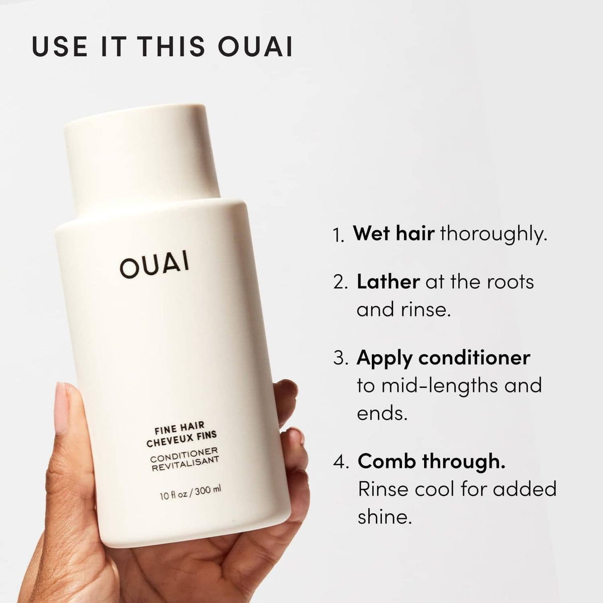 Fine hair conditioner bottle by OUAI held in hand, white label and pump.