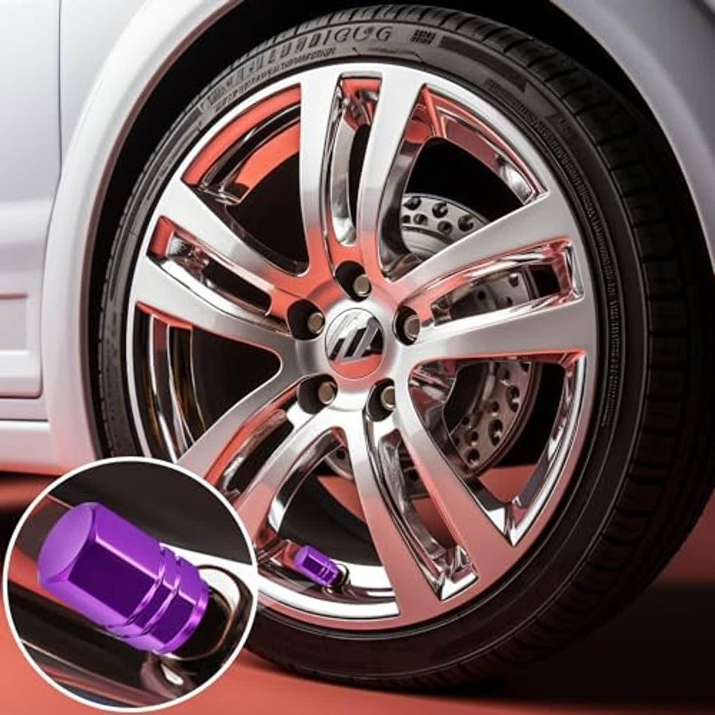 Purple tire valve stem caps with rubber O-ring, installed on a car wheel valve.