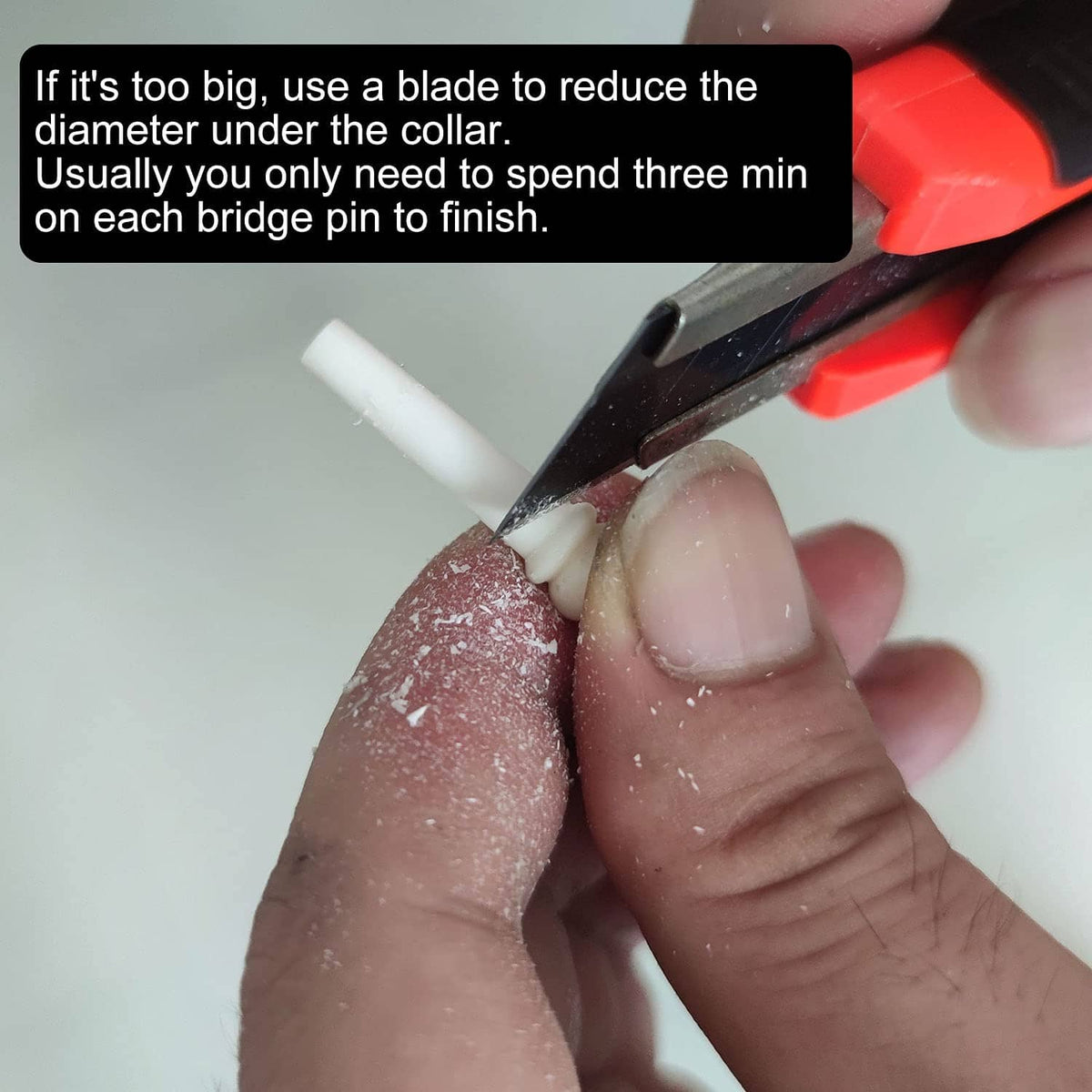 Hand trimming bone acoustic guitar bridge pin using blade tool