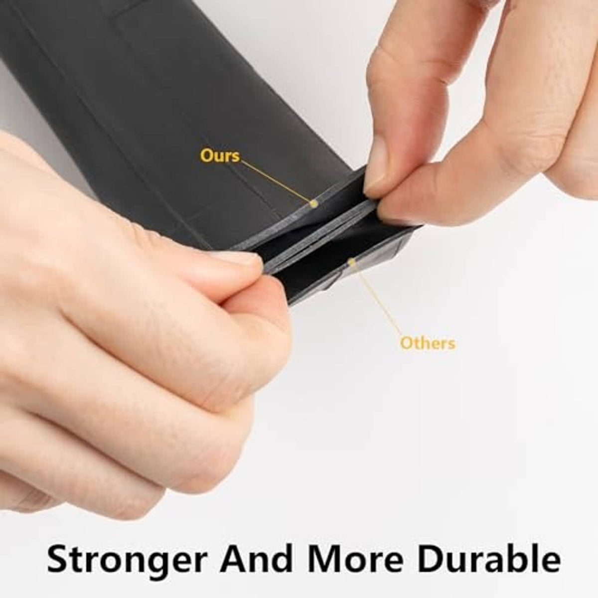 Black bike inner tube held by hands, showing reinforced seam area