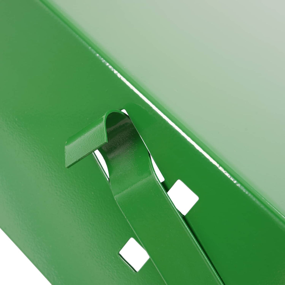 Close-up of green battery box side latch area and cutout openings