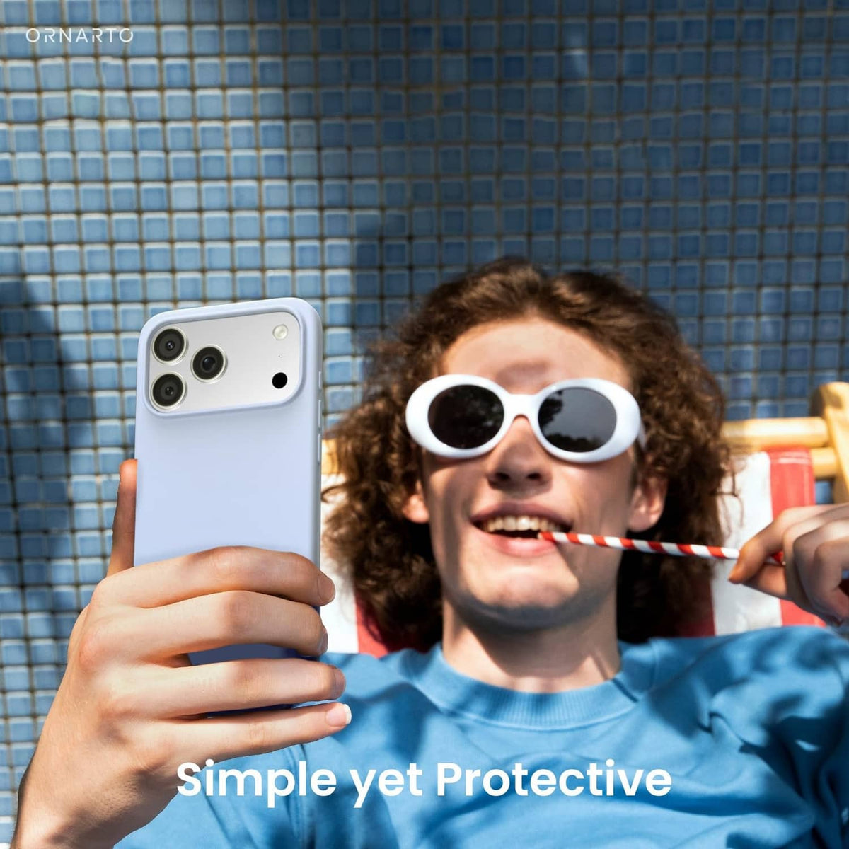 Baby blue iPhone case in hand, slim profile with camera lens covers.
