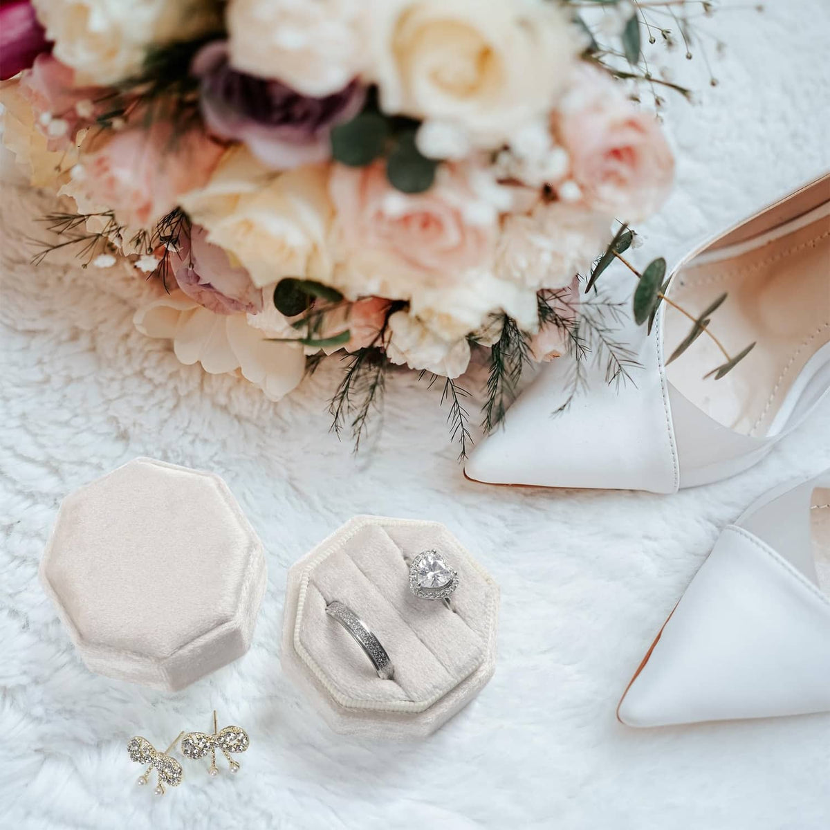 Beige octagon velvet ring box set, one open with ring on cushion