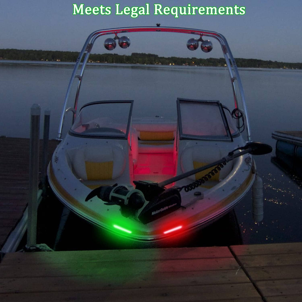 Boat at dock with illuminated green and red bow navigation lights at dusk