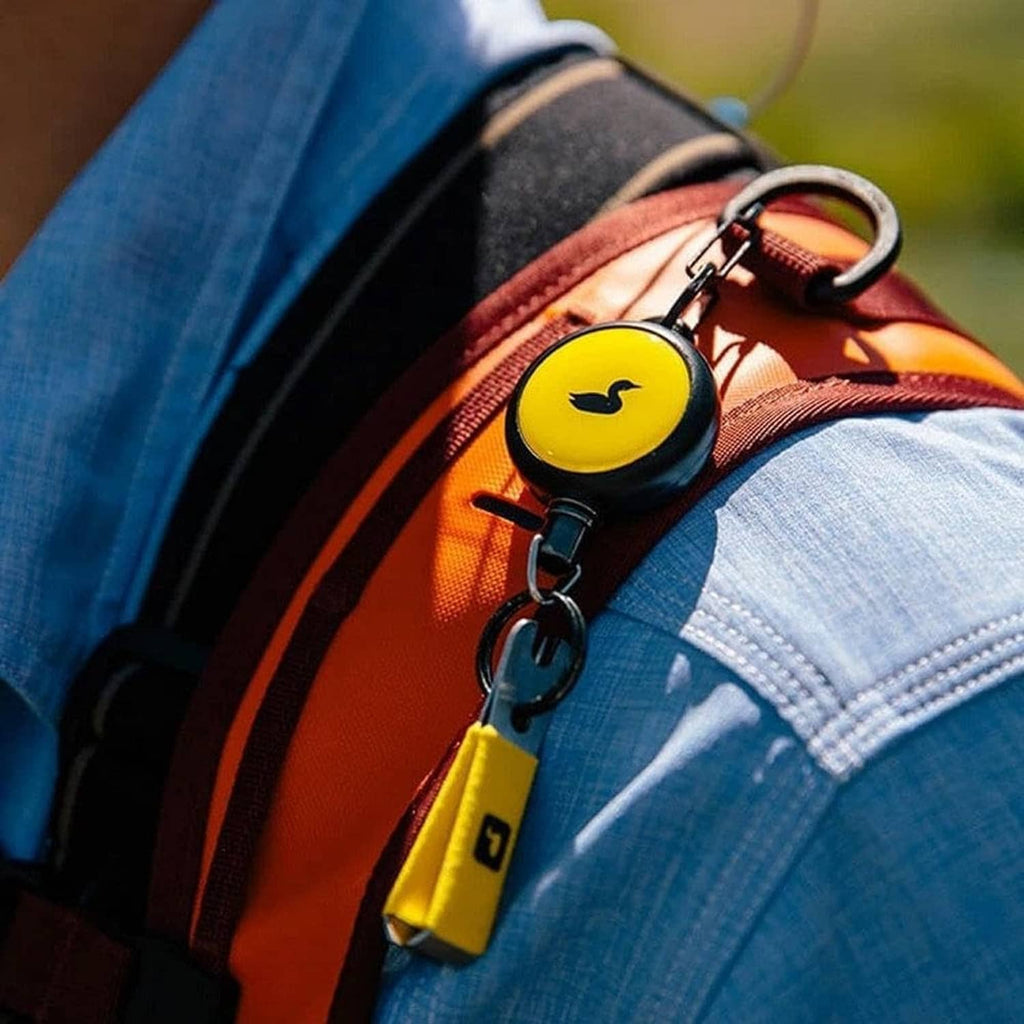 Yellow clip tag with D-ring and black carabiner on black strap