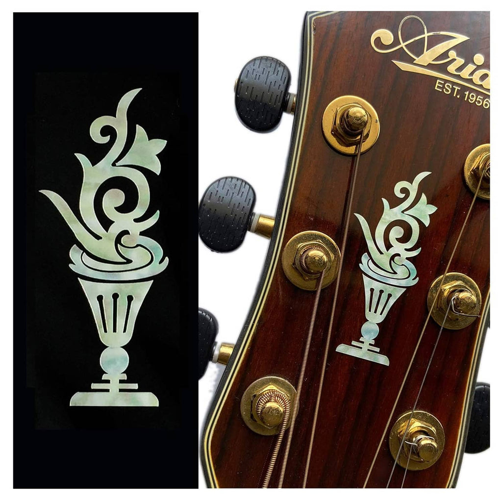 Inlay decal sticker showing teal cup and candlestick icons on dark backing