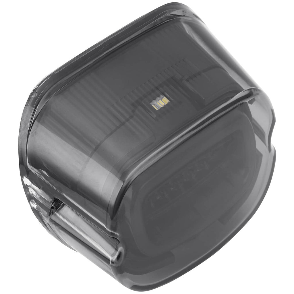 Smoked LED rear tail light lens in clear side close-up, compact oval body