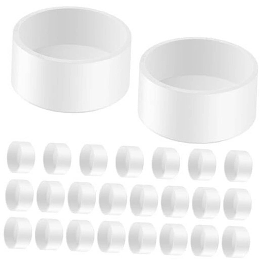 White PVC pipe end caps, round slip-on pieces (two shown)