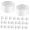 White PVC pipe end caps, round slip-on pieces (two shown)