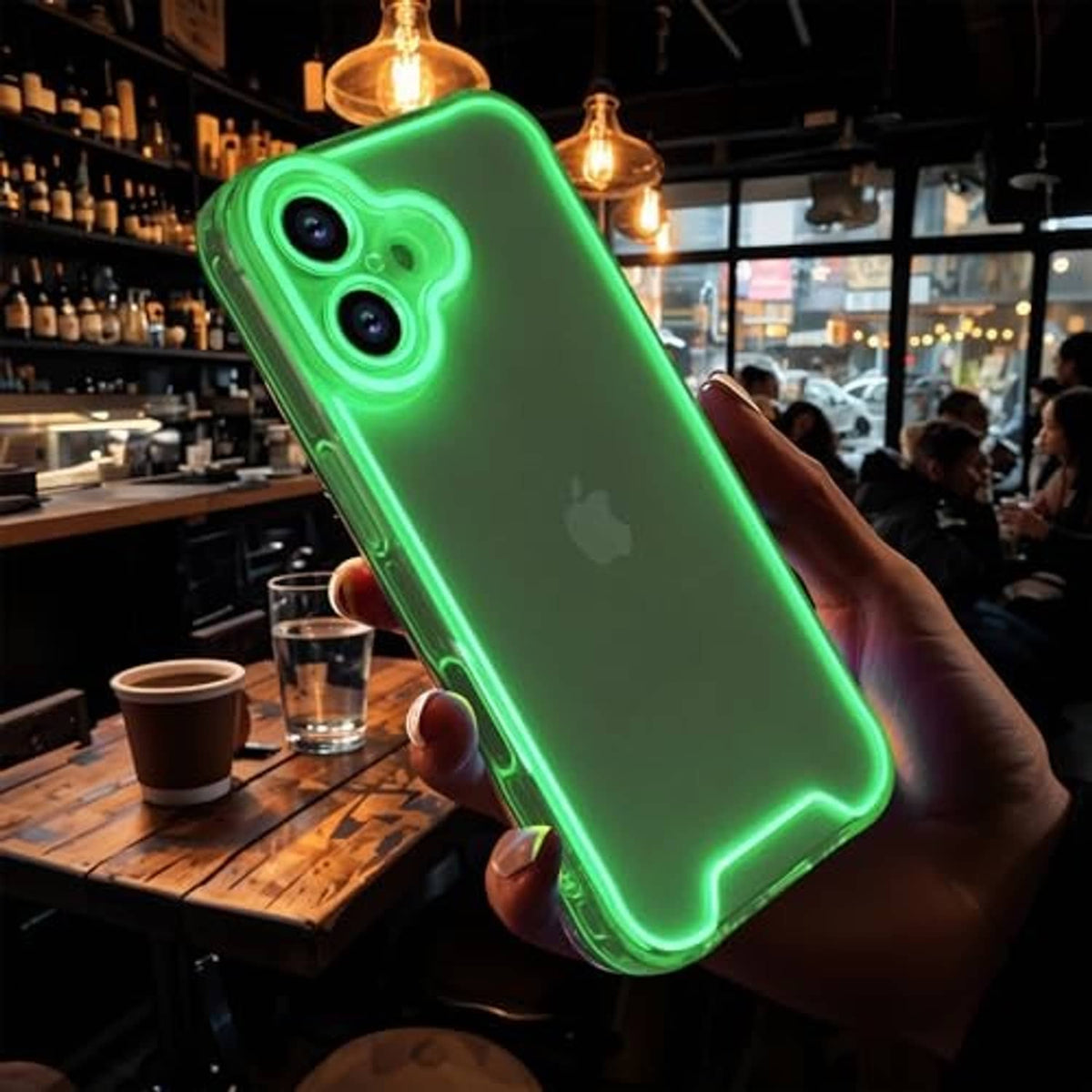 Green clear phone case with luminous border held in hand; dual camera cutouts visible.