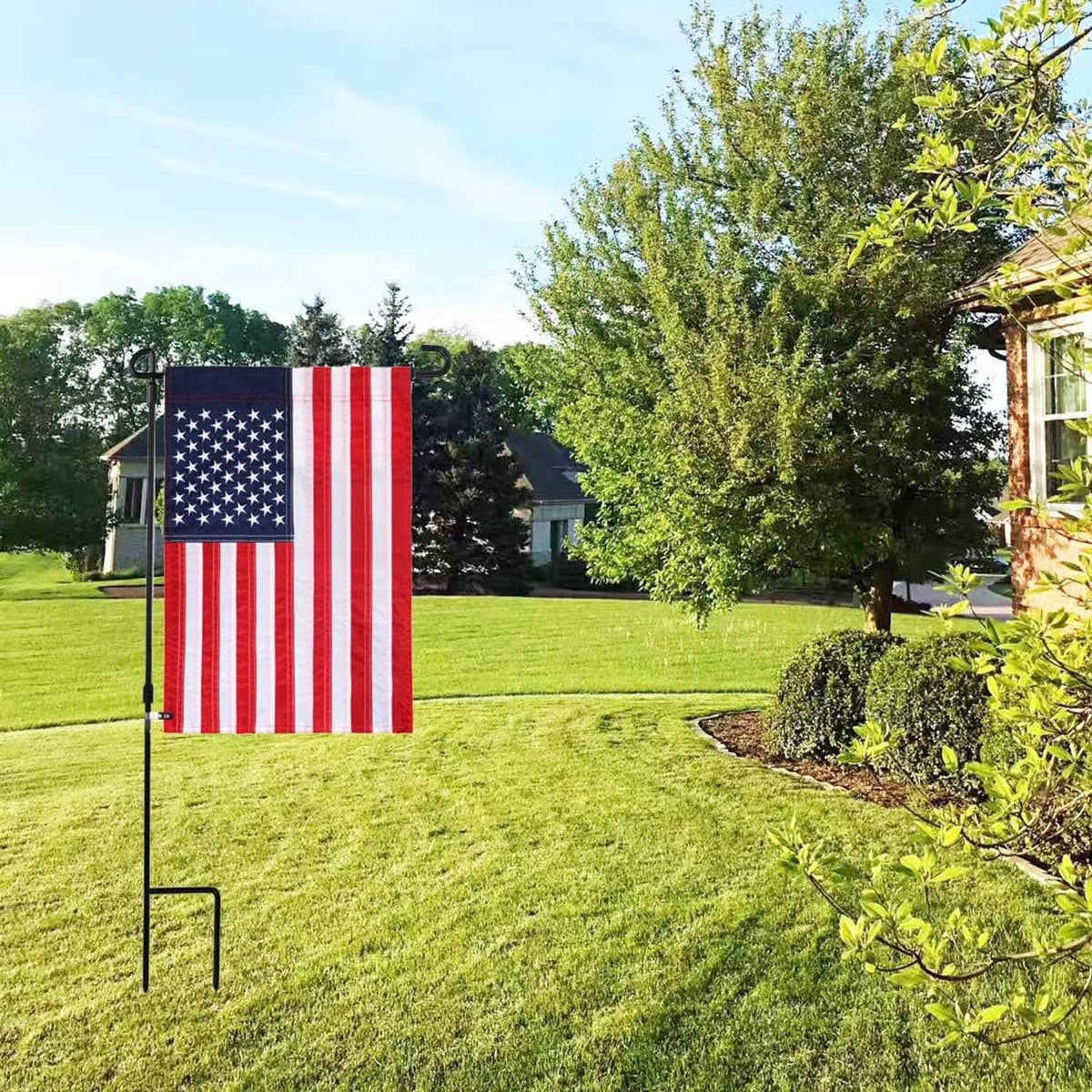Garden flag on yard stakes with anti-wind clips and rubber stoppers installed