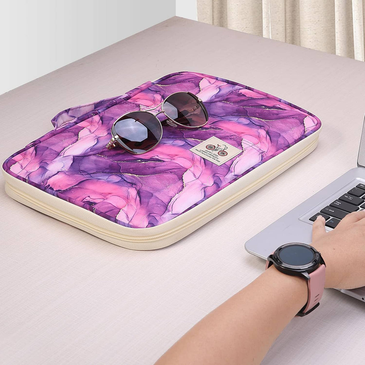 Purple marble-pattern travel portfolio case with zippered cover open
