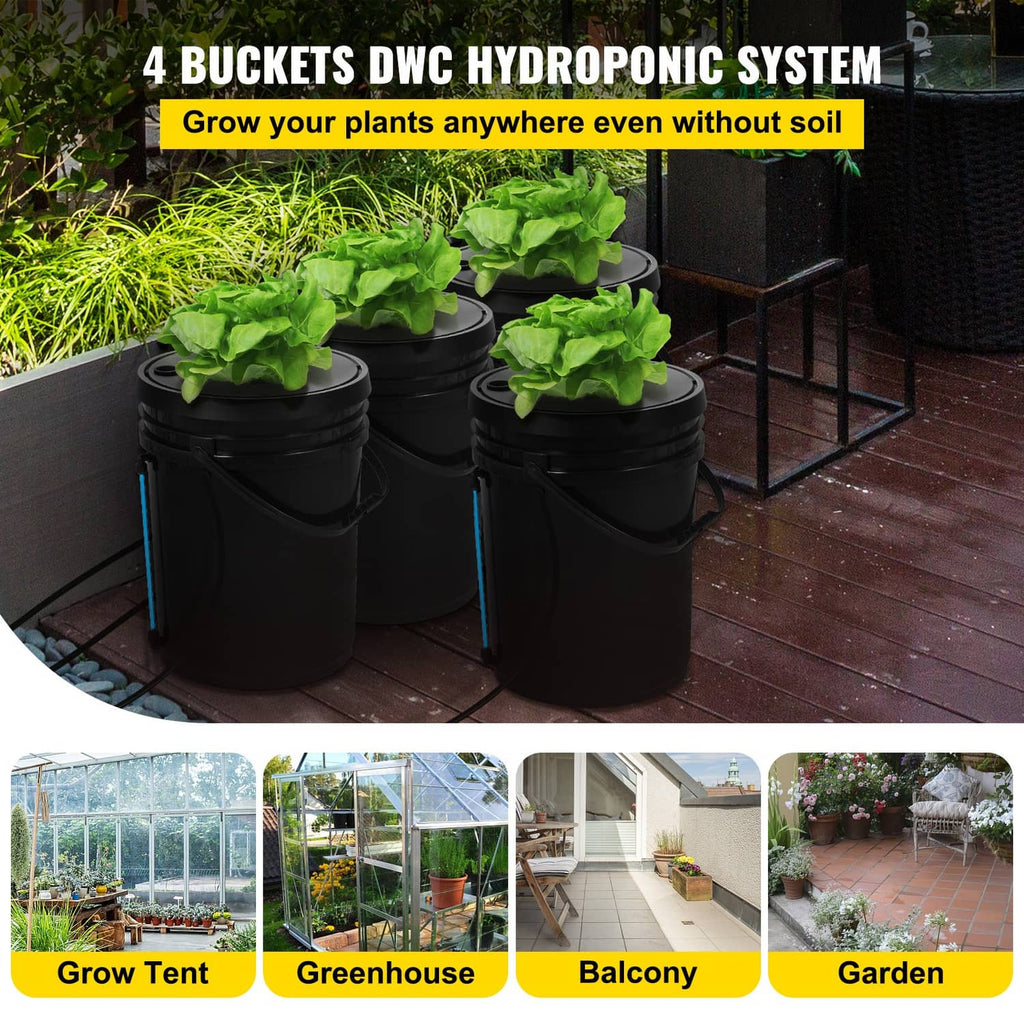 Four black DWC buckets on a patio with leafy greens in the lids