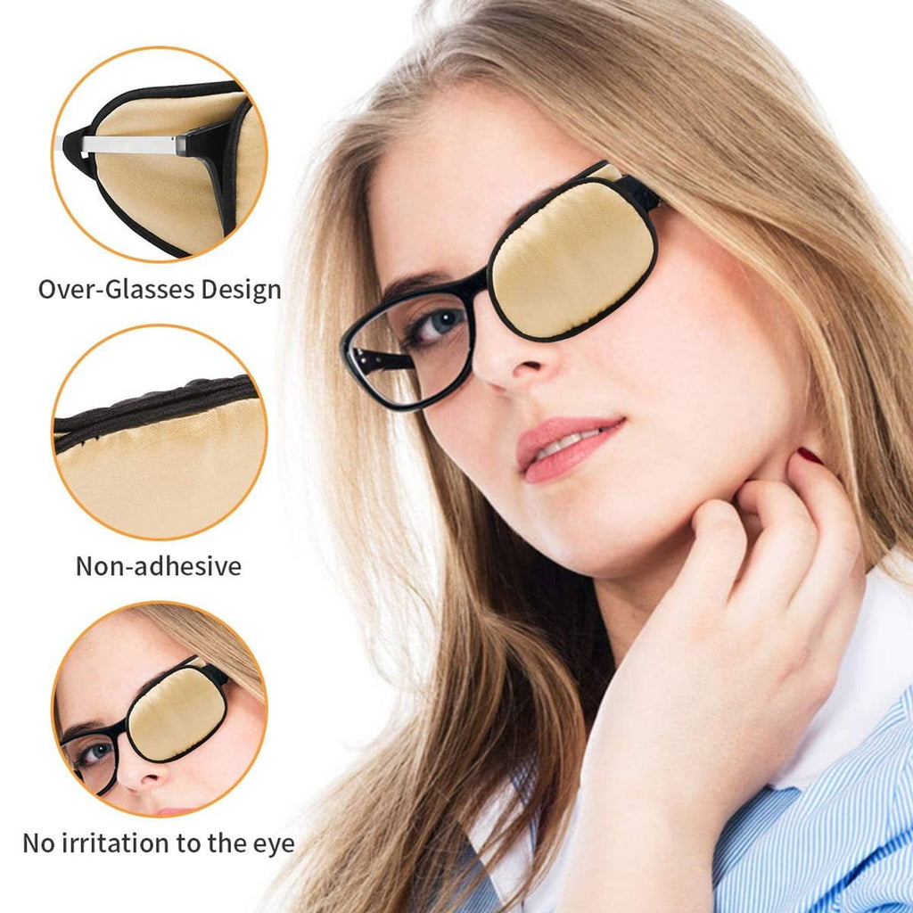 Beige non-adhesive eye patch with black border worn over glasses on one side.