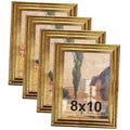 Set of 4 ornate gold 8x10 photo frames with vintage-style borders.