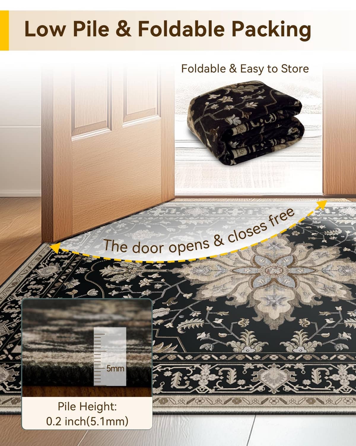 Black low-pile rectangular area rug with ornate border and floral center
