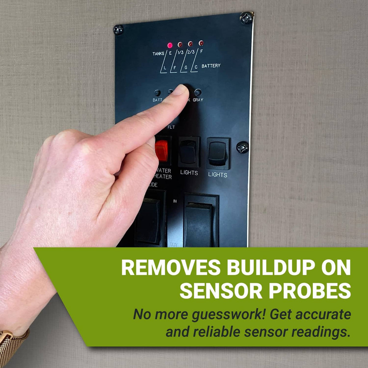 RV control panel for tank sensor probes with indicator lights and a hand pressing buttons