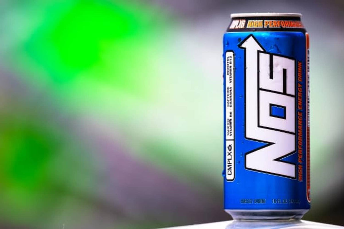 Blue CMPX6 energy drink can standing upright with logo and flavor text