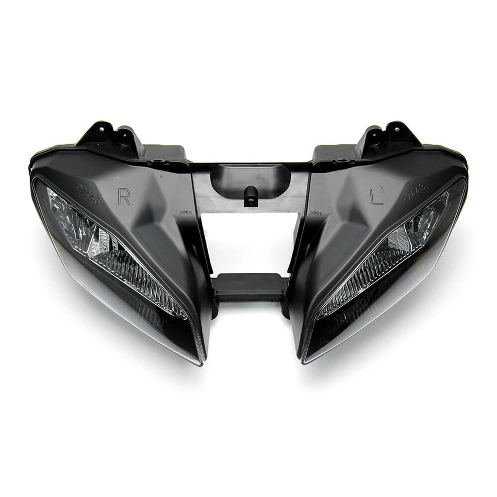 Pair of front headlight housings with clear lenses and center mounting bracket