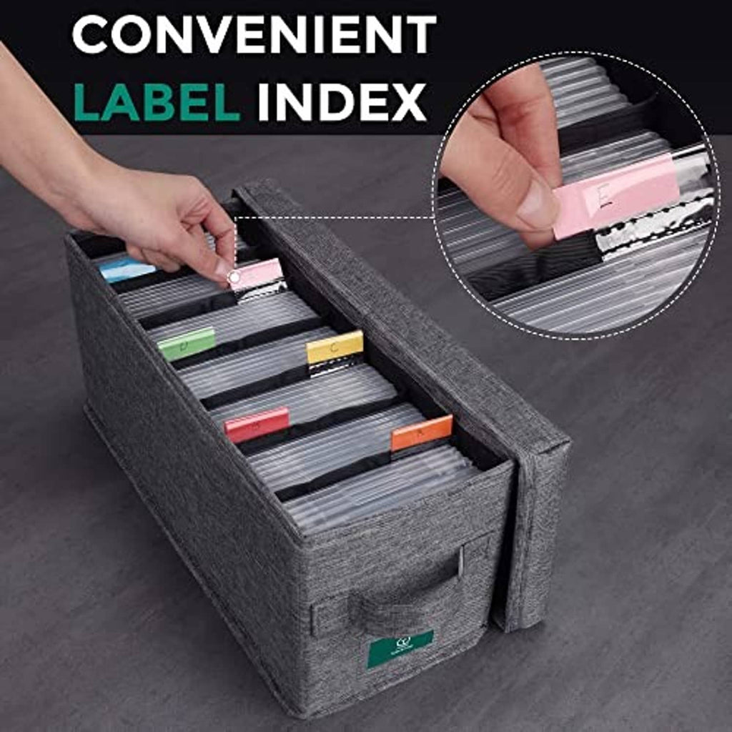 Gray CD storage box with lid, hand lifting colored labels from disc sleeve slots