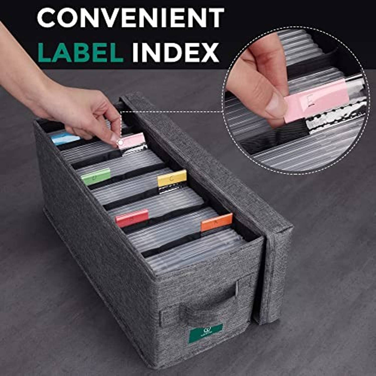 Gray CD storage box with lid, hand lifting colored labels from disc sleeve slots