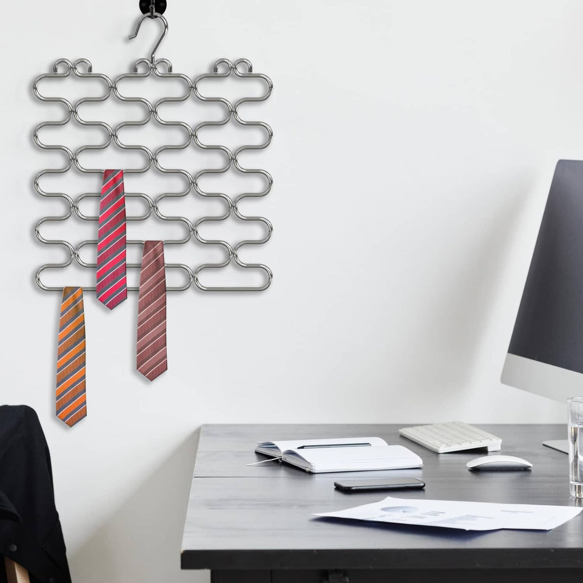 Chrome loop scarf hangers holding striped ties and patterned ties