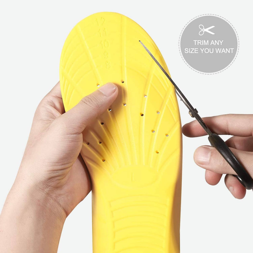 Yellow insole underside with perforation dots, held in hand for sizing