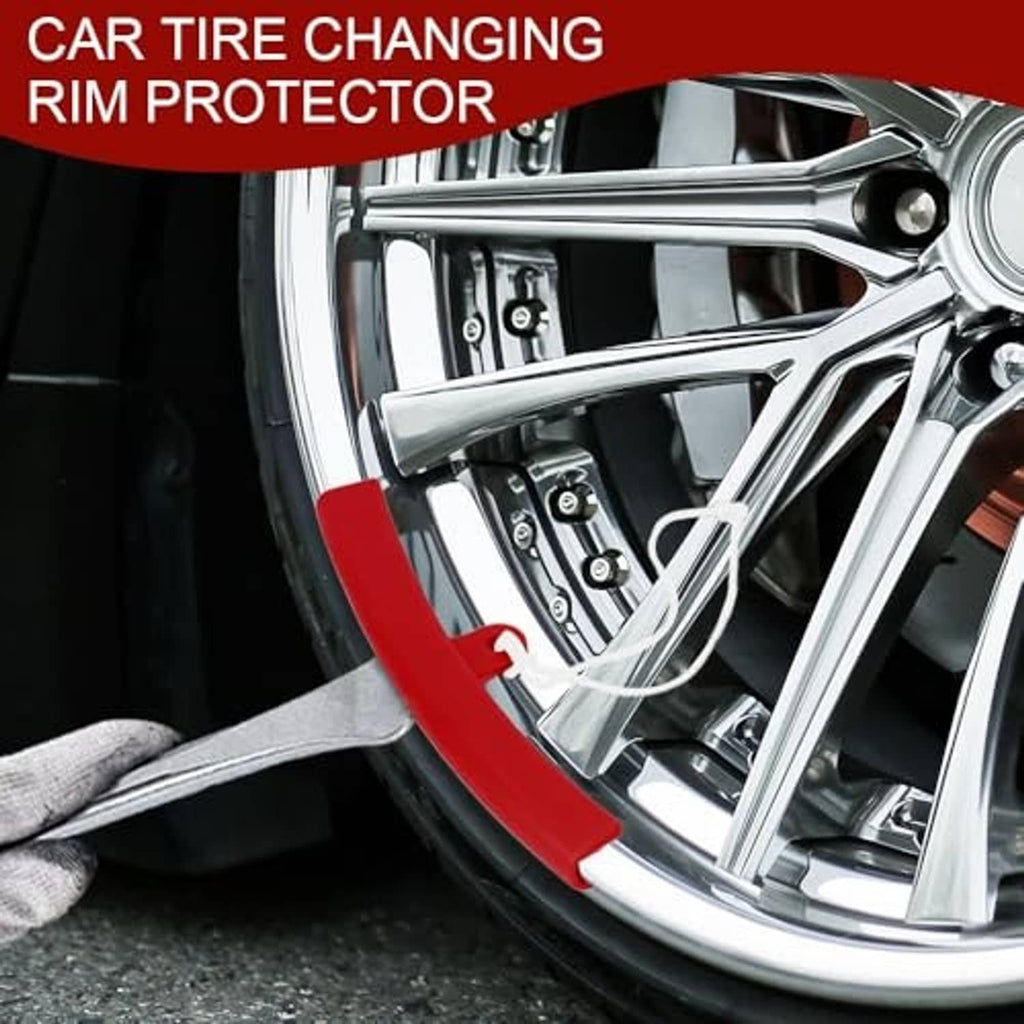Red tire-changing rim protector fitted to wheel edge with white rope tie