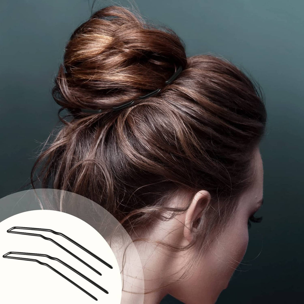 Black U-shaped hairpins holding a low bun hairstyle, pins visible near crown