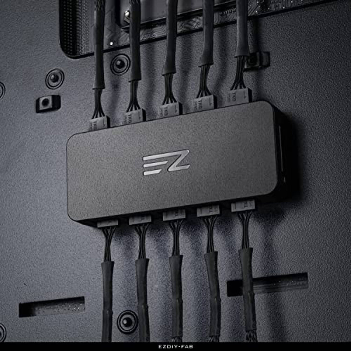 PWM fan hub controller close-up with multiple fan cables plugged into the front