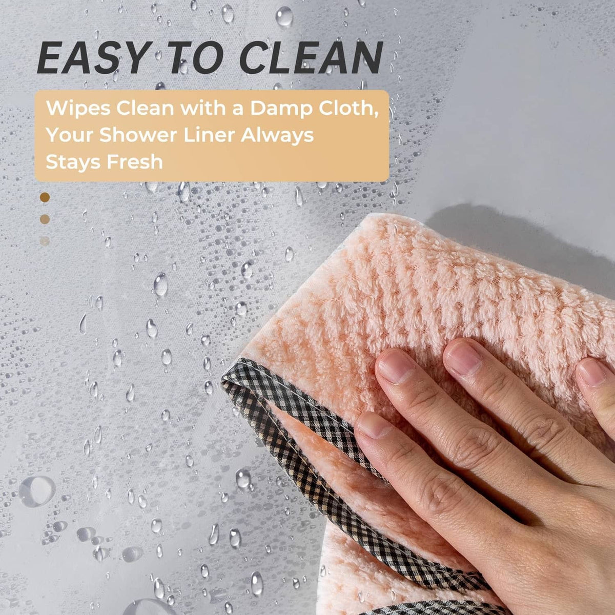 Grey shower curtain with water droplets, shown with a hand smoothing the fabric