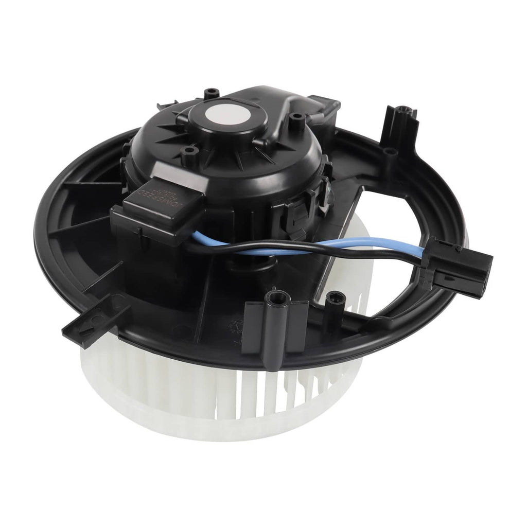 HVAC blower motor housing with wiring harness and white fan wheel, top view