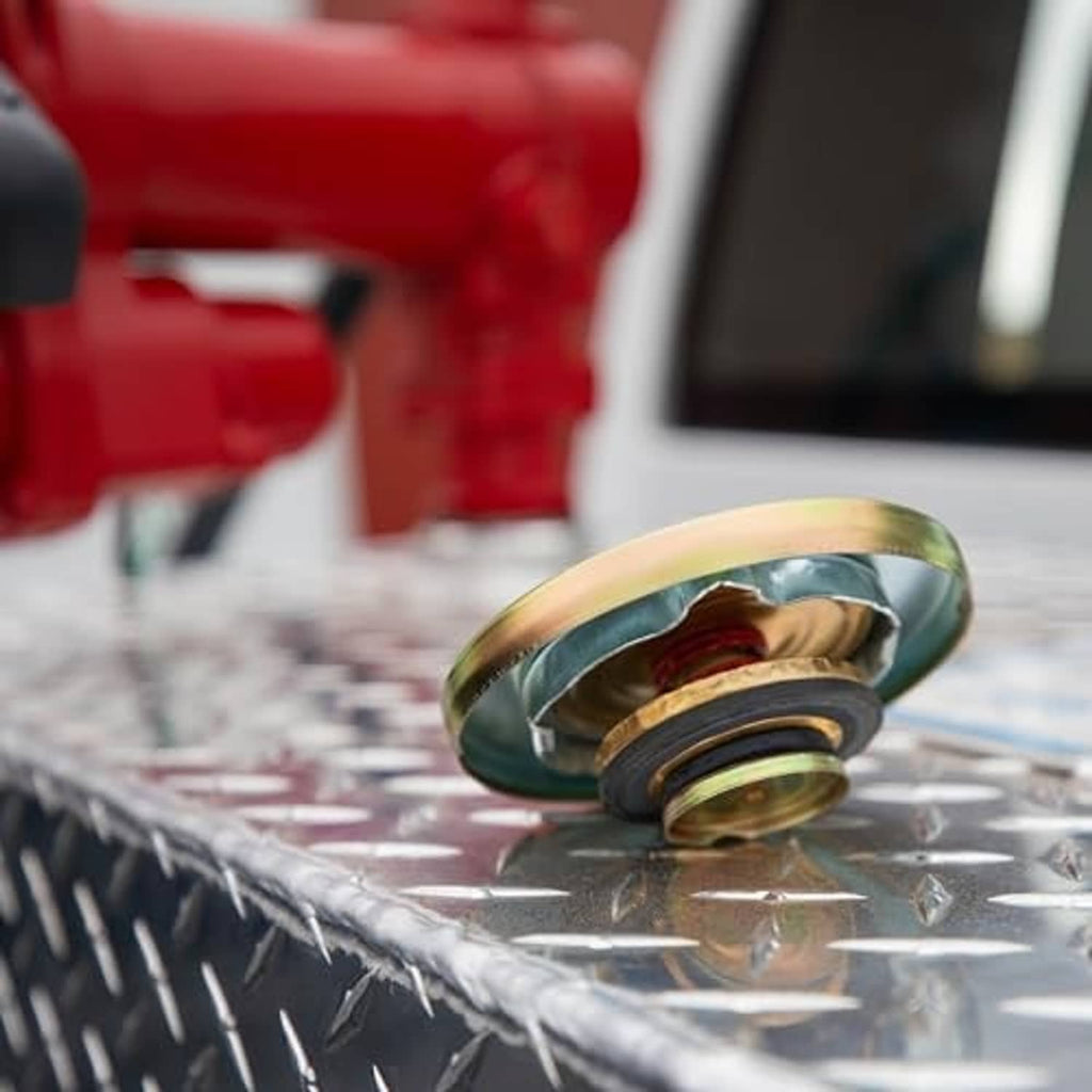 Installed tank vent cap with rainbow top and black gasket on a metal tank
