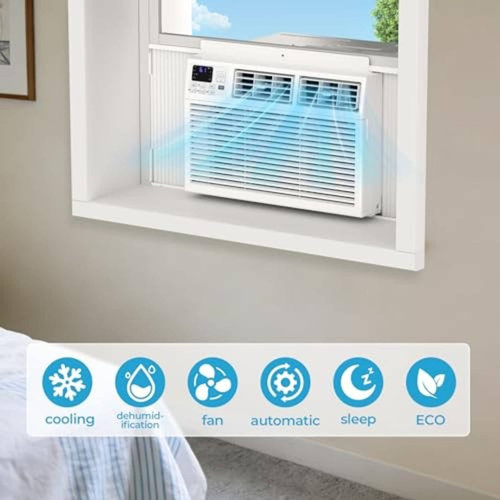 White window air conditioner installed in window opening with front grille and airflow