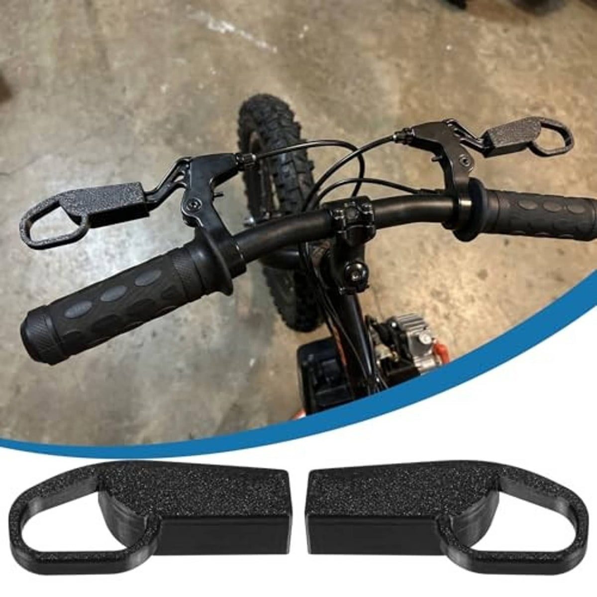 Mounted black brake lever extensions on bike handlebars, two-piece set