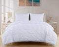 White king comforter set with quilted pinch pleat pattern and two matching pillow shams