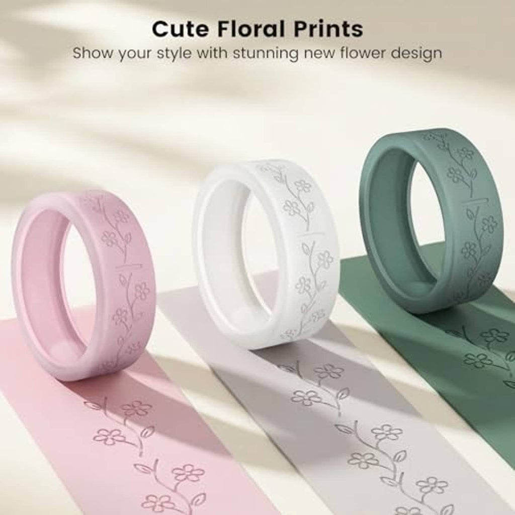 Three ultra-thin ring covers with floral prints in pink, white, and deep teal