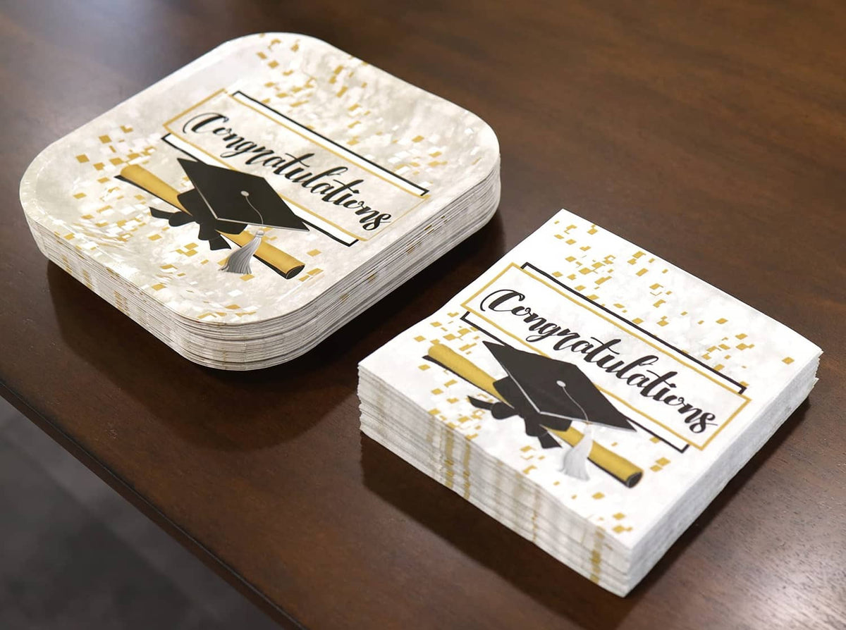 Stack of graduation party paper napkins with 'Congratulations' and black cap design