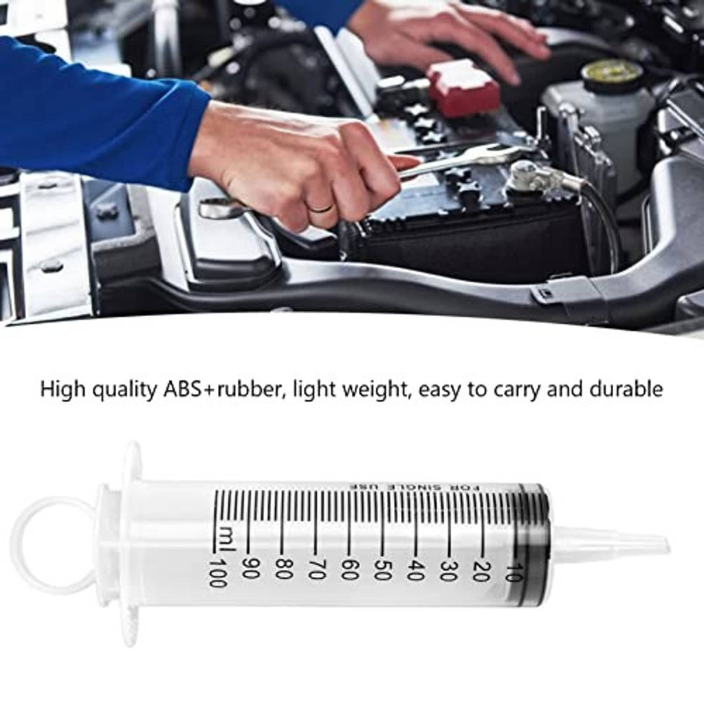 Hydraulic brake bleeder syringe with measurement markings shown with kit for vehicle use