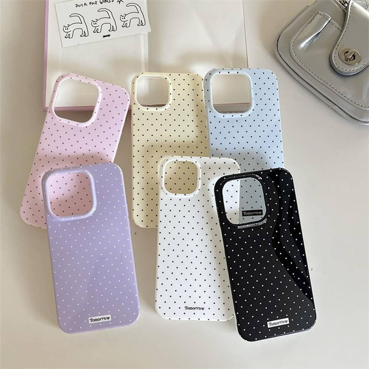 Light blue dotted iPhone 13 Pro case with camera cutouts and side button openings